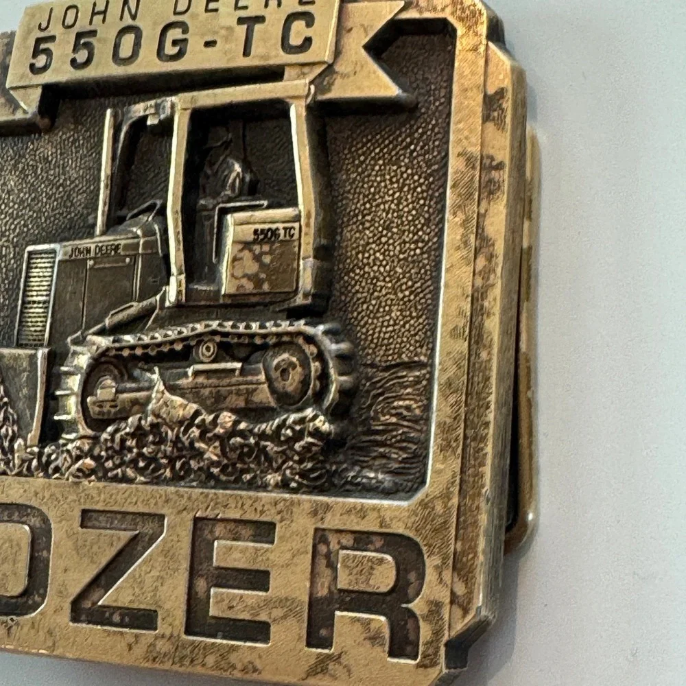John Deere vintage brass